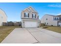 Two-story house with gray siding, white garage door, and a landscaped lawn at 230 Wathen Dr, Goose Creek, SC 29445