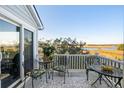 Relaxing deck overlooking marsh views with outdoor seating at 2335 Tall Sail Dr # 508H, Charleston, SC 29414