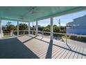 Spacious deck with white railings and ocean views at 305 Matilda St, Edisto Beach, SC 29438