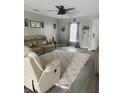 Spacious living room with gray walls, hardwood floors, and a large sectional sofa at 319 Bradley Bend Dr, Moncks Corner, SC 29461