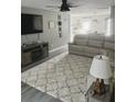 Open living room with gray walls, hardwood floors, and comfortable seating at 319 Bradley Bend Dr, Moncks Corner, SC 29461