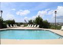 Community pool with ample lounge chairs, perfect for relaxation at 3701 Docksite Rd # 320, Edisto Beach, SC 29438
