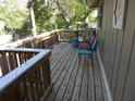 Wooden deck with chairs, offering relaxing outdoor space at 506 Jungle Rd, Edisto Island, SC 29438