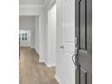 Bright entryway with hardwood floors and neutral-colored walls at 9991 Winged Elm St, Ladson, SC 29456