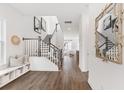 Bright entryway with hardwood floors, staircase, and built-in bench at 1073 Keeper Ln, Summerville, SC 29485