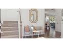 Bright entryway with staircase, bench, and decorative mirror at 185 Belfort Pl, Summerville, SC 29486