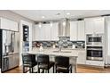 Modern kitchen with island, granite counters, and stainless steel appliances at 192 Collared Dove Ct, Summerville, SC 29483