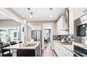 Open concept kitchen with island, granite counters and stainless steel appliances at 192 Collared Dove Ct, Summerville, SC 29483