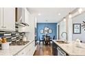 Modern kitchen with granite counters and stainless steel appliances at 192 Collared Dove Ct, Summerville, SC 29483