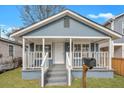 Quaint blue house with white trim, porch, and mailbox at 1984 Hugo Ave, North Charleston, SC 29405