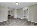 Spacious living room with grey floors and access to other rooms at 1984 Hugo Ave, North Charleston, SC 29405