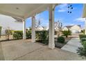 Covered front porch with white columns and view of neighborhood at 199 Schooner Bend Ave, Summerville, SC 29486