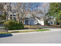 Street view of a neighborhood with houses and lush greenery at 359 Muirfield Pkwy, Charleston, SC 29414