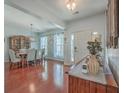 Open dining room with hardwood floors and chandelier at 369 Waterlily Way, Summerville, SC 29486