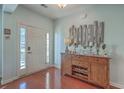 Bright entryway with hardwood floors and decorative console table at 369 Waterlily Way, Summerville, SC 29486