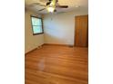 Bright bedroom with hardwood floors and a ceiling fan at 4765 S Constellation Dr, North Charleston, SC 29418