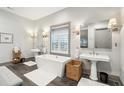 Elegant bathroom with double vanities, soaking tub, and tile floors at 4991 Timber Race Crse, Hollywood, SC 29449
