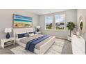 Bright bedroom with a queen-size bed and backyard view at 558 Richfield Way, Summerville, SC 29486