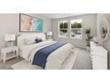 Spacious bedroom with a queen bed and large windows at 558 Richfield Way, Summerville, SC 29486