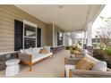 Inviting front porch with comfortable seating and stylish decor at 563 Richfield Way, Summerville, SC 29486