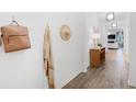 Bright and airy hallway with hardwood floors and stylish decor at 563 Richfield Way, Summerville, SC 29486