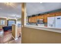 Kitchen features wood cabinets and stainless steel appliances at 7963 Shadow Oak Dr, North Charleston, SC 29406