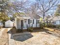 Gray house with driveway and detached shed at 1343 E Montague Ave, North Charleston, SC 29405