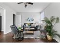 Cozy living room with dark hardwood floors, and a comfy couch at 1343 E Montague Ave, North Charleston, SC 29405