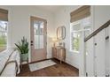 Stylish entryway with a decorative door, hardwood floors, and a charming mirror at 1474 Mizzen Aly, Johns Island, SC 29455