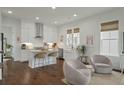 Open kitchen with white cabinets, granite countertops, and a kitchen island at 1474 Mizzen Aly, Johns Island, SC 29455