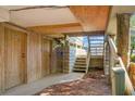 Exterior access to basement storage with wooden stairs and doors at 1625 Live Oak Park, Seabrook Island, SC 29455