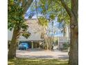 Condo building with parking area under the building, surrounded by trees at 1625 Live Oak Park, Seabrook Island, SC 29455
