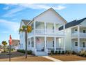 Two-story white house with a front porch and American flag at 1680 Banning St, Mount Pleasant, SC 29466