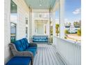 Front porch with seating and a porch swing at 1680 Banning St, Mount Pleasant, SC 29466