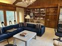 Spacious living room with a fireplace and built-in shelving at 19 Fort Royal Ave, Charleston, SC 29407