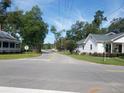 Quiet residential street with houses and landscaping at 206 Dukes St, Saint George, SC 29477