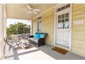 Cozy porch with wicker furniture, creating a relaxing outdoor space at 212 Calhoun, Charleston, SC 29401