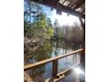 Serene view of a calm lake from a wooden deck at 218 Cat Hole Ln, Branchville, SC 29432