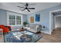 Bright living room with gray sofa and orange armchair at 2268 Bailey Dr, North Charleston, SC 29405