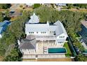 Elevated view of home, pool, and surrounding landscape at 2302 Palm Blvd, Isle of Palms, SC 29451