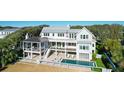 Luxury home with pool and expansive deck; two-story design at 2302 Palm Blvd, Isle of Palms, SC 29451