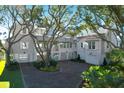 Two-story home with driveway and lush landscaping at 2302 Palm Blvd, Isle of Palms, SC 29451