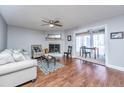 Living room with hardwood floors, fireplace and access to a sunroom at 2311 Tall Sail Dr # B, Charleston, SC 29414