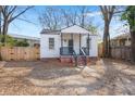 Charming exterior showcasing a quaint home with a welcoming front porch and gravel driveway at 2889 Alabama Drive, North Charleston, SC 29405