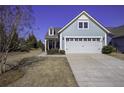 Gray siding house with two-car garage and manicured lawn at 304 Bloomington Way, Summerville, SC 29486