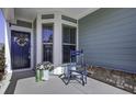 Inviting front porch with rocking chair and potted plants at 304 Bloomington Way, Summerville, SC 29486
