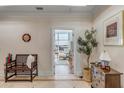 Charming hallway with stylish bench, decorative tree, and doorway with an ocean view at 355 Cooper River Dr, Mount Pleasant, SC 29464