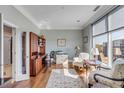Bright office space with large window, hardwood floors, and built-in wooden shelves at 355 Cooper River Dr, Mount Pleasant, SC 29464