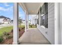 Covered front porch with white columns and gray siding at 3725 Grange Cir, Summerville, SC 29486