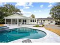 Inviting backyard oasis featuring a sparkling pool and spacious deck at 3906 Waterway Blvd, Isle of Palms, SC 29451